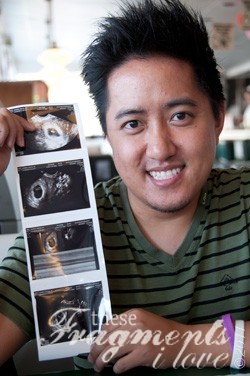 Louie holding Bumble Bee's ultrasound pics