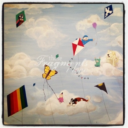 Painting of Calvin, Rainbow, Gaelen, kites, and dogs in the clouds
